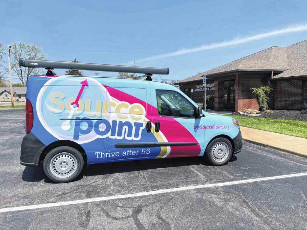 A brightly colored vehicle from SourcePoint was parked at the Genoa Township Hall on April 19, where the first of three workshops was held.